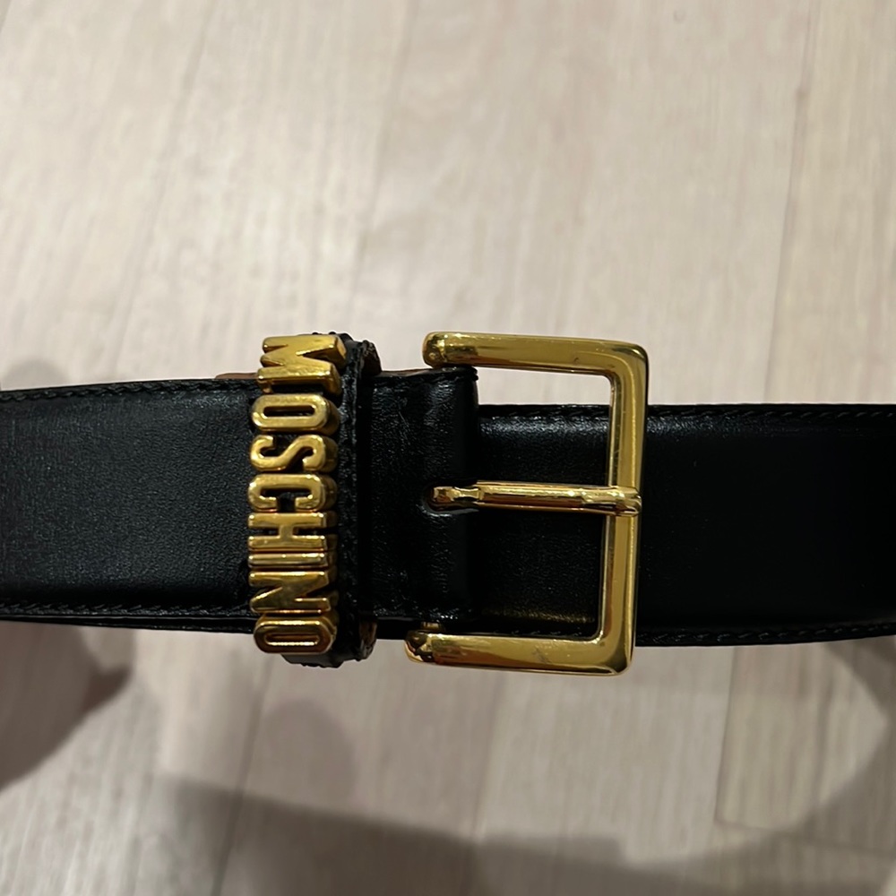 Authentic Moschino Ladies black leather belt. Gold Moschino lettering.size 44